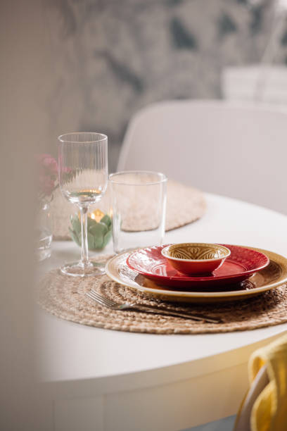 istock Colorful place setting indoors in dining room on kitchen table crockery and cutlery 1207057568