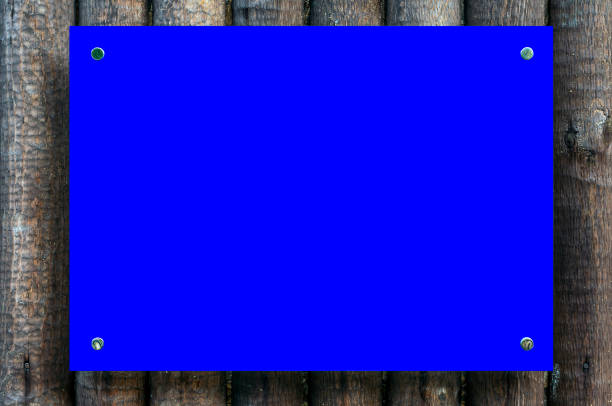 istock Blank banner/information board on the wooden wall 1207057958