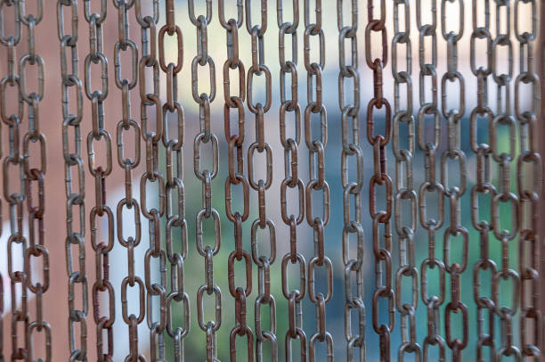 istock Closeup of the hanging steel chains 1207058834