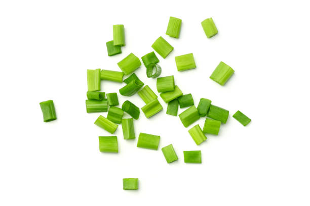 istock Fresh green onions isolated on white background. Top view 1207059573