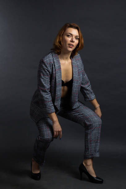 istock portrait of a redhead in a Studio with on a dark background. 1207060479