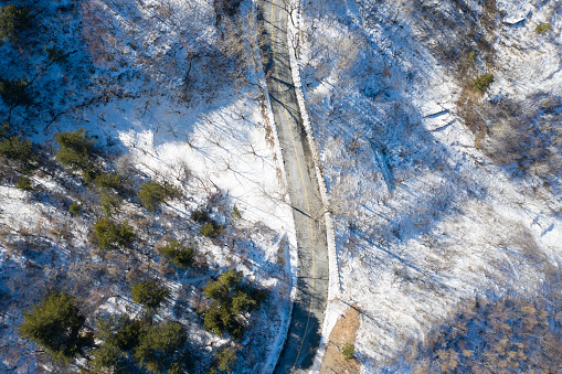 Aerial View on House on Remote Location in Forest in Winter.