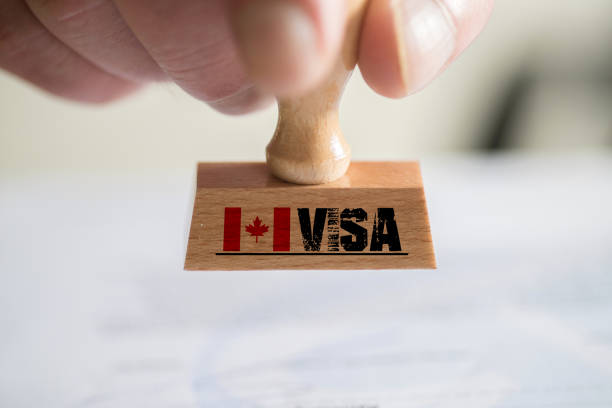 un sello y visa para canadá - passport stamp customs document emigration and immigration fotografías e imágenes de stock