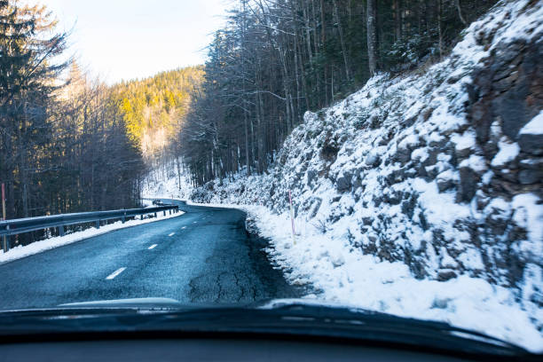 istock Driving on Asphalt Country Road in Winter 1207062879