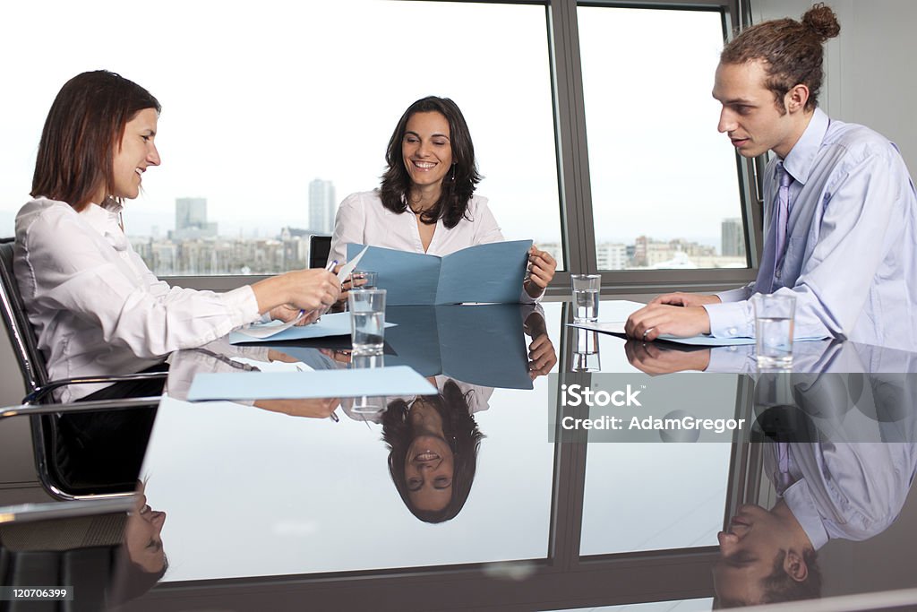 Checking the files with an trainee Checking the files with an trainee in the meeting room Advice Stock Photo