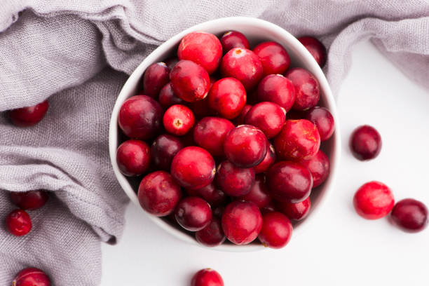 Ceramic bowl of Cranberry on white background