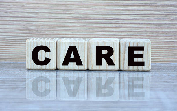 istock concept word care on cubes on a beautiful gray background 1207064847