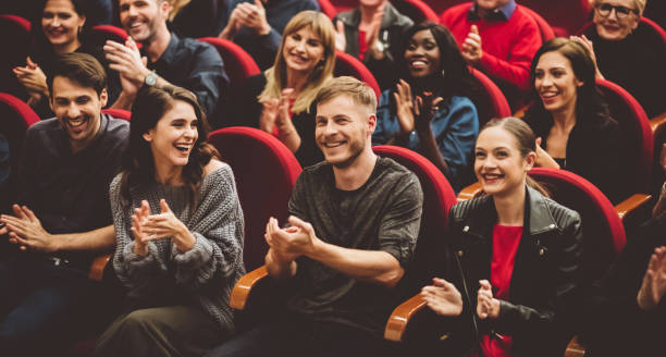 istock Happy audience applauding in the theater 1207065646