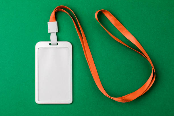 istock Blank security tag with a red stripe neck on a green background. Place for text, layout 1207066503