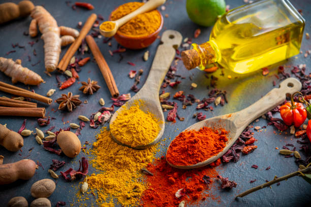 Spices herbs condiments seasoning on grunge gray background Spices herbs condiments seasoning on grunge gray table background saffron plant stock pictures, royalty-free photos & images