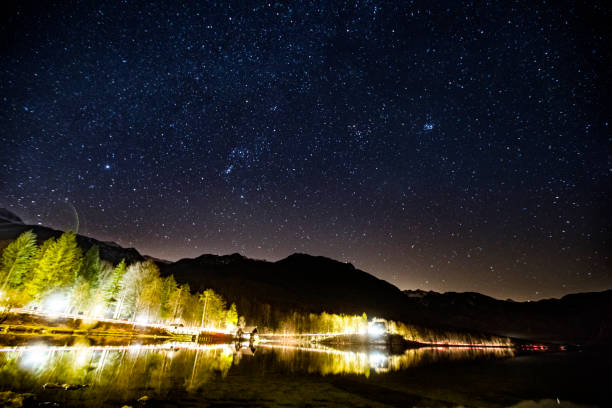 istock Illuminated Road By Lake Bohinj at Night 1207067838