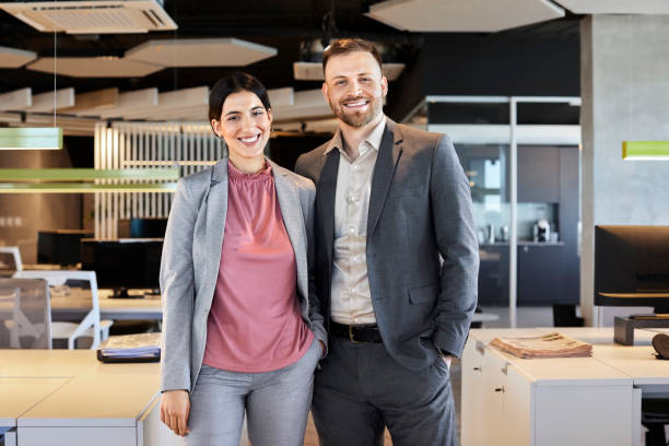 istock Portrait of smiling professionals at workplace 1207067867
