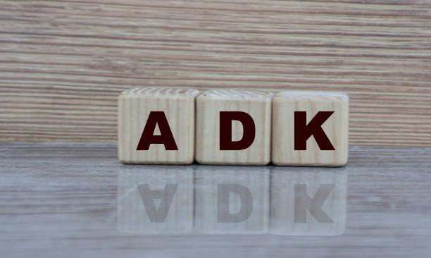 istock concept word ADK on wooden cubes on a gray background 1207068016