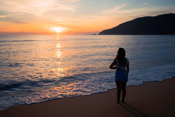 istock Woman at the beach 1207068993
