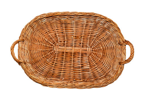 Wicker basket with handles on the sides in the shape of a rectangle, flat top view, isolated on a white background with a clipping path.