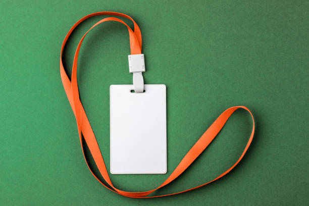 istock Blank security tag with a red stripe neck on a green background. Place for text, layout 1207070841