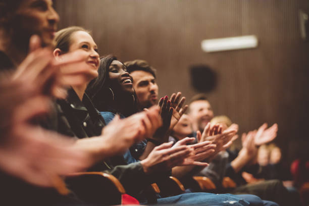 istock Happy people applauding in the theater 1207070899