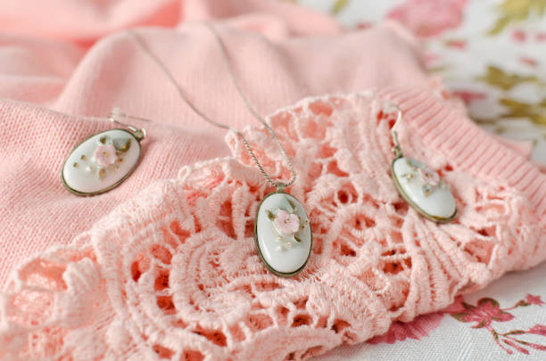 istock Earrings and pendant on a chain with an oval-shaped brass frame with a porcelain cabochon insert 1207071052