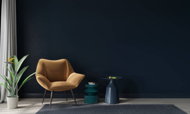 mustard armchair and colored tables against a dark blue wall - showcase interior inside of domestic room indoors imagens e fotografias de stock