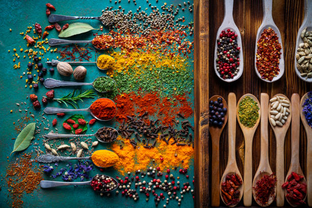 istock Spices herbs seasoning condiments on vintage spoons 1207074040