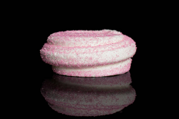 istock Sweet pastel meringue isolated on black glass 1207075703