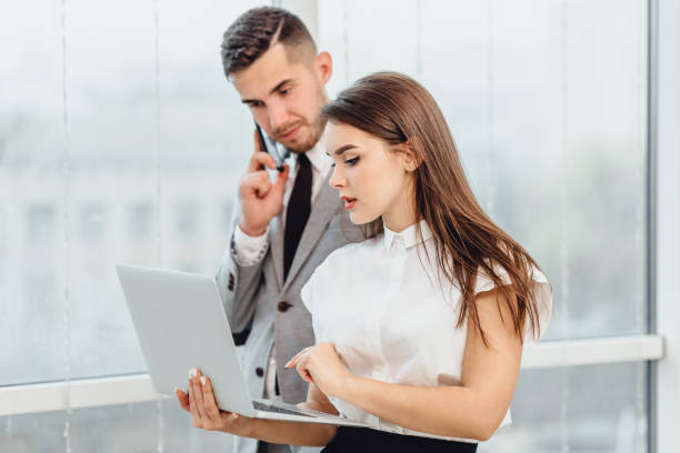istock Business people analysing business risks in office environment. 1207076147