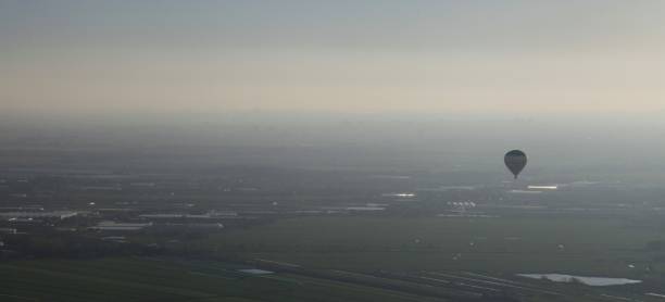 istock Hot air balloon above The Netherlands 1207076235