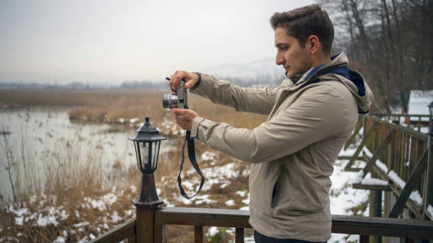 Man taking picture on a winter day