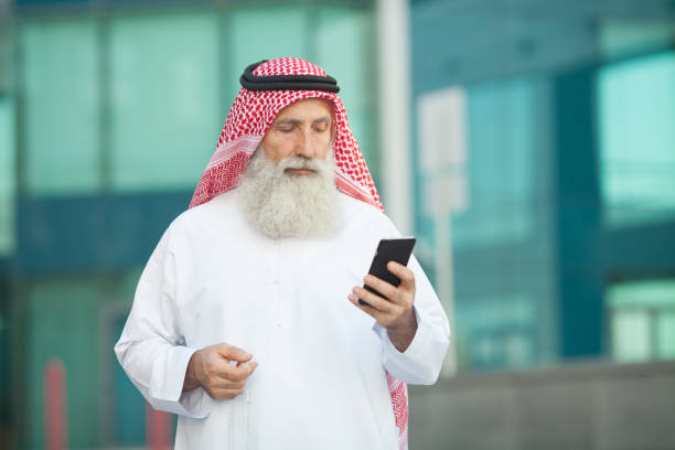 istock Arab businessman working with his phone. 1207081504