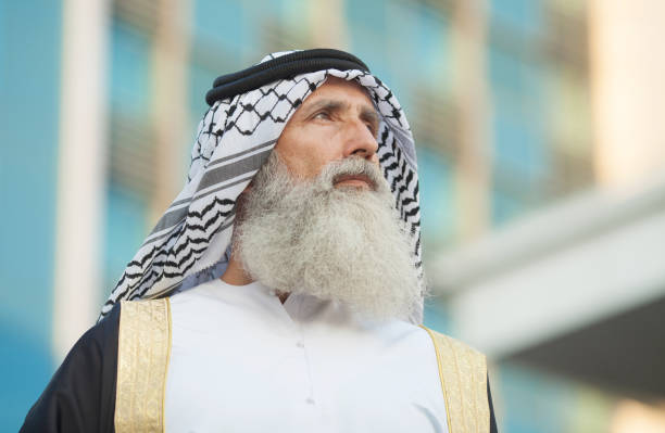 Arabian young man wearing traditional clothes with a seascape of Arabian gulf. image