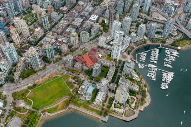 False Creek Aerial, Vancouver, British Columbia, Canada Wide angle aerial view of modern apartments and boats in False Creek, Vancouver, British Columbia, Canada false creek stock pictures, royalty-free photos & images