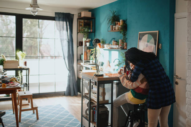 istock Mother and daughter embracing at home 1207082893