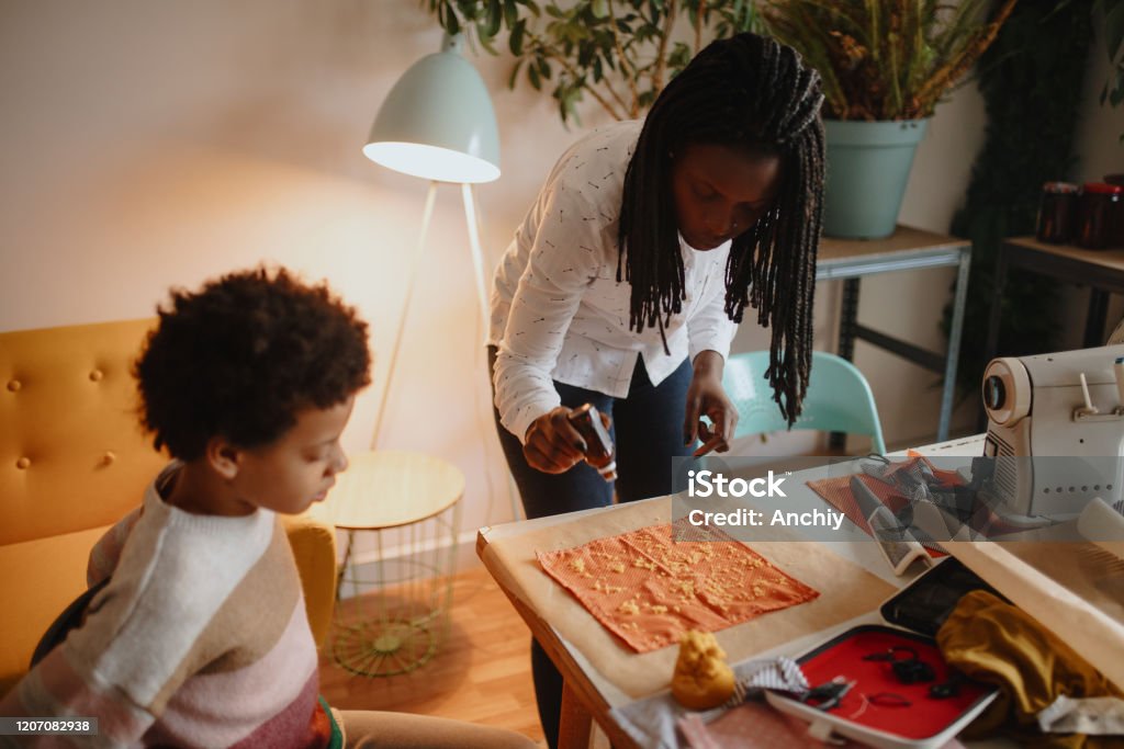 Mother and daughter making handmade Bees Food Wraps Beeswax with jojoba oil makes perfect beeswax food wrap Beeswax Wrap Stock Photo