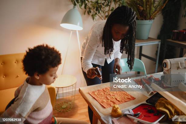 Mother And Daughter Making Handmade Bees Food Wraps Stock Photo - Download Image Now