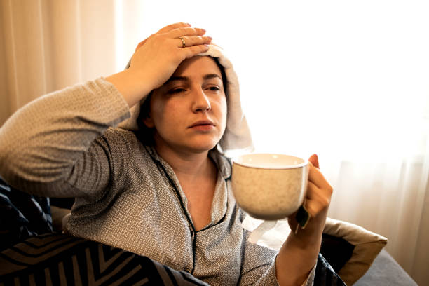 istock Ill Woman with the Flu at Home 1207084641