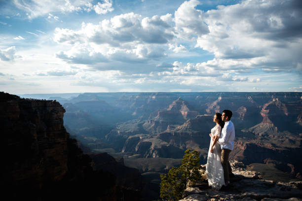 istock Newlyweds cuddle with stunning canyon view 1207086381