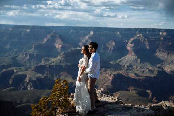 istock Newlyweds cuddle with stunning canyon view 1207086390