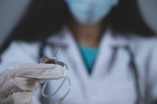istock doctor hand syringe with ill 1207087132
