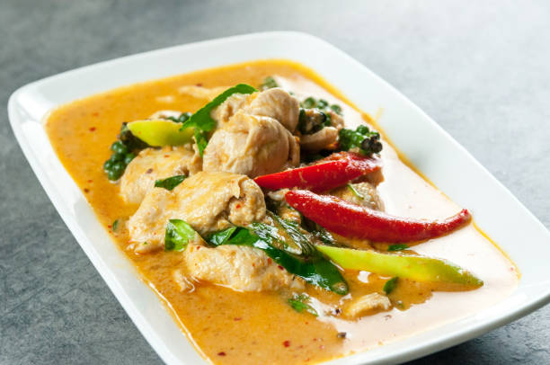 istock Stir fried chicken and curry paste, thai food 1207090897