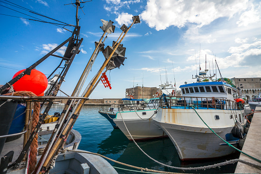 Fishing boats at the harbor in Monopoli Puglia Italy