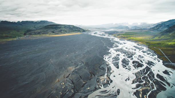 istock Drone view of Seljalandsfoss waterfall at summer time with a huge delta river riverbed. 1207091921