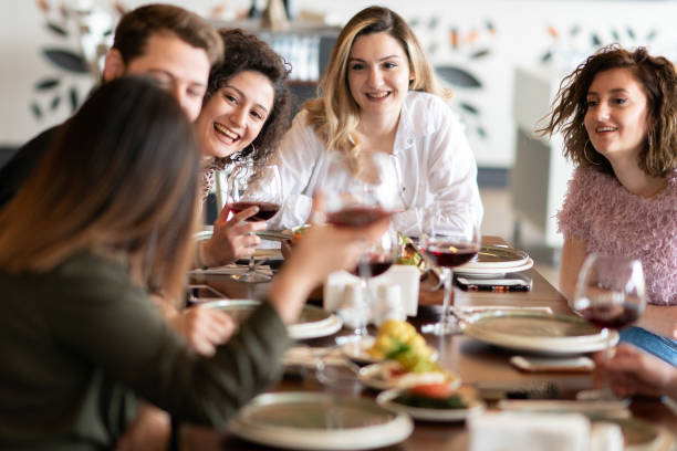 istock Group of friends meet in a restaurant 1207092657