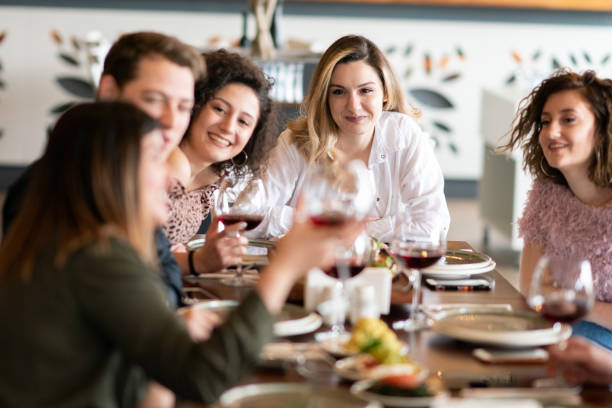 istock Group of friends meet in a restaurant 1207092932