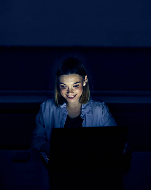 istock laptop computer, night dark looking office late working ciber space 1207092993