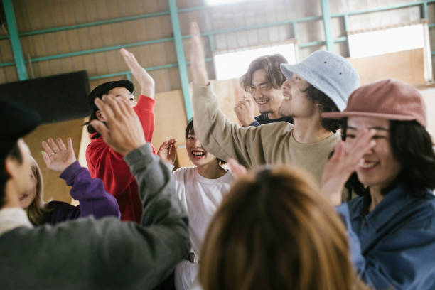 istock Group of skateboarders celebrating. 1207093121