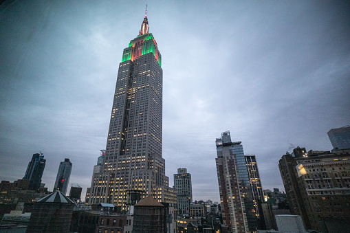 New York, United States - December 22nd, 2017: View of the Empire State Building at dusk illuminated for Christmas