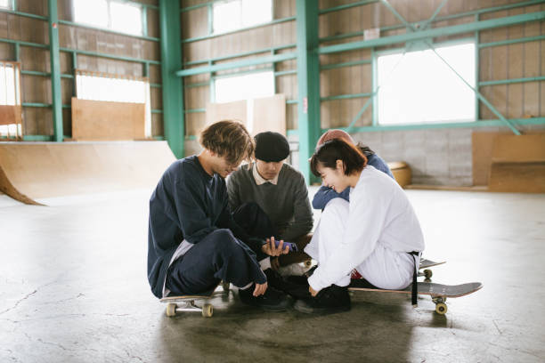 Friends watching skateboarding videos.