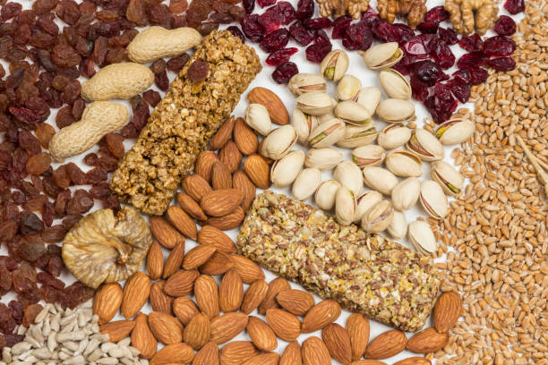 istock Balanced protein granola bar. Nuts, seeds, cereals on wooden background 1207093387