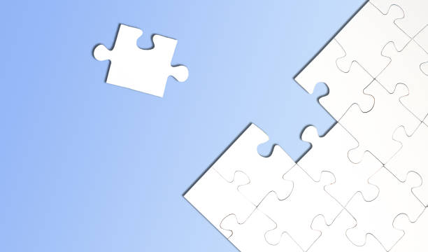 istock top view of jigsaw puzzle with one piece left on blue background 1207095182