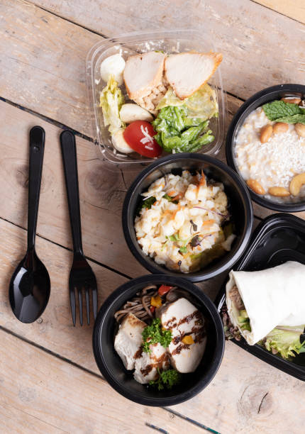istock Tasty lunch in plastic containers on wooden table close up 1207095665